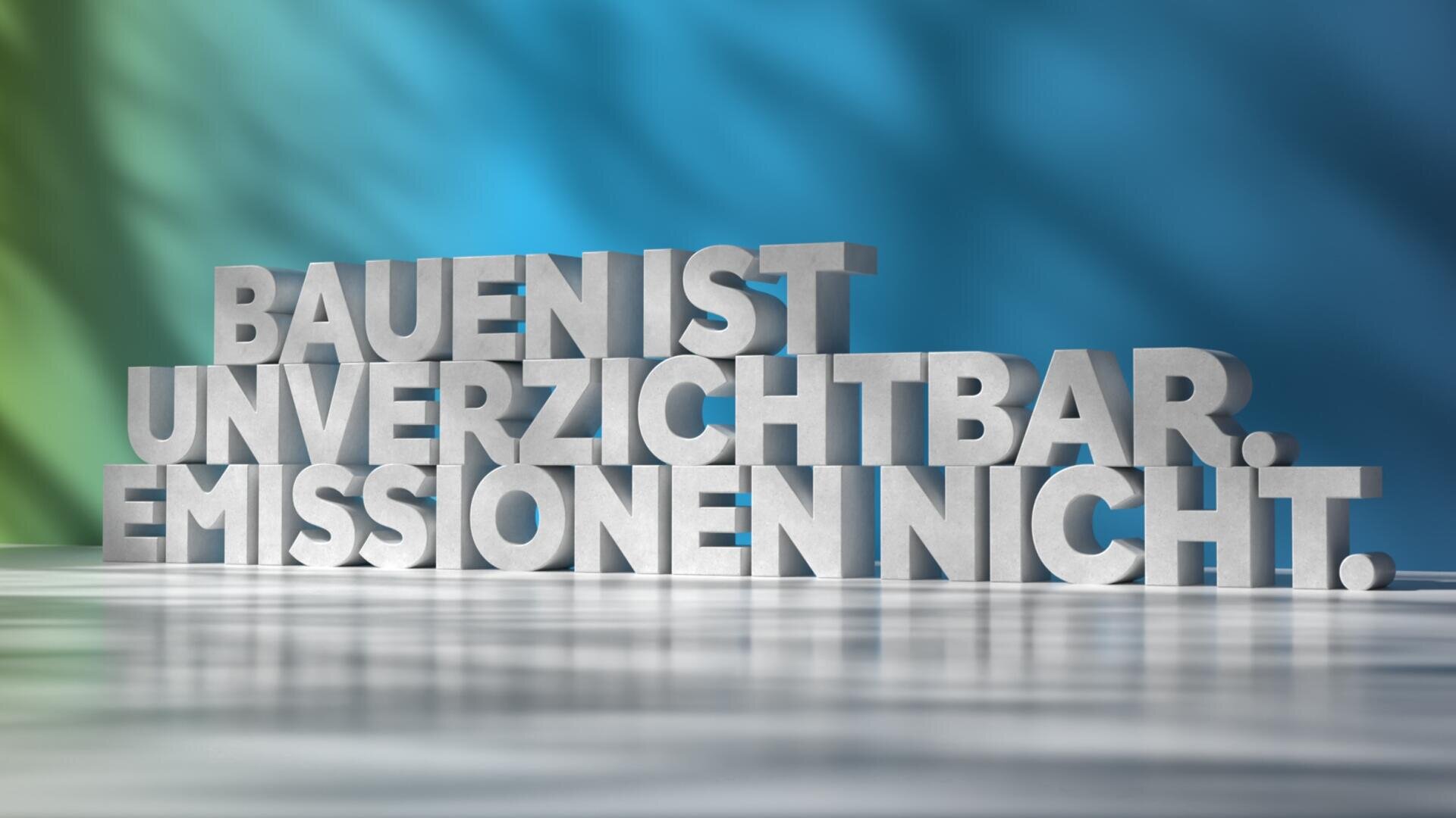 Ein großer 3D-Text in deutscher Sprache auf einer reflektierenden Oberfläche lautet: "Bauen ist unverzichtbar. Emissionen nicht." Der Hintergrund ist ein Farbverlauf aus Blau und Grün mit weichen Schatten.