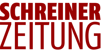Der Schriftzug SCHREINER ZEITUNG ist in großen, fetten, roten Großbuchstaben auf weißem Hintergrund zu lesen.